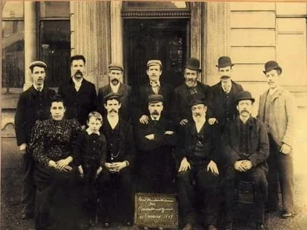 Founders of Great Mountain Workingmen's Club gathered outside the building